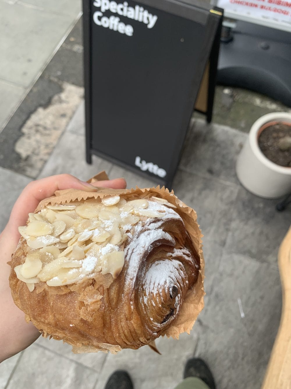 An almond croissant outside the Lytte storefront